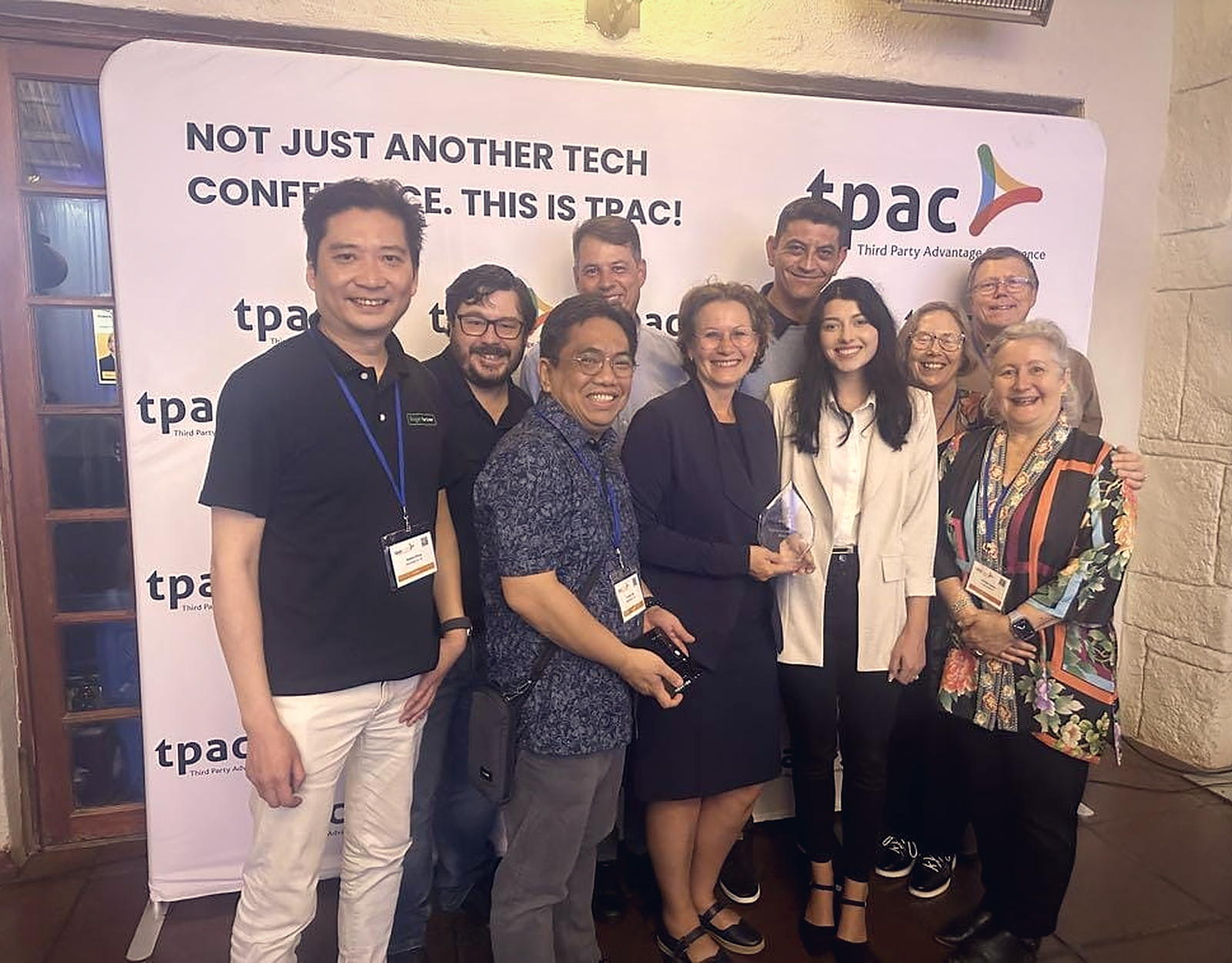 Delegates together at the TPAC South Africa backdrop