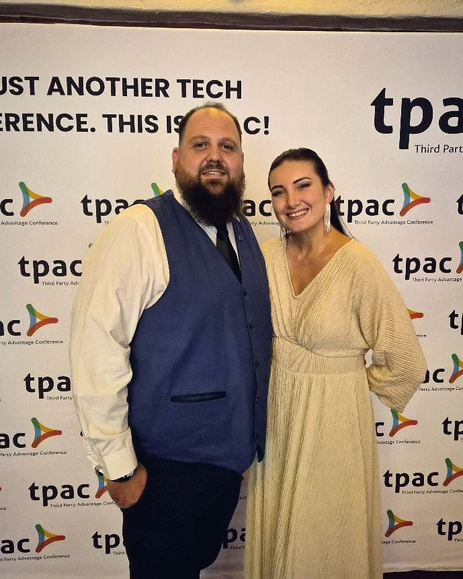 Two delegates together at the TPAC backdrop