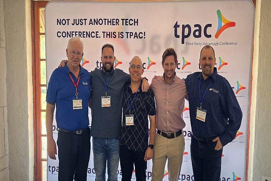 Delegates meet against the TPAC South Africa backdrop.